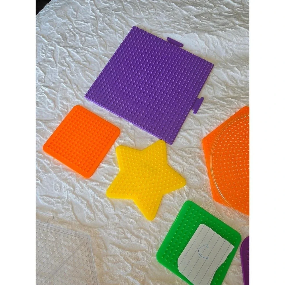 Lot C Perler bead pegboards in various shapes and bright colors